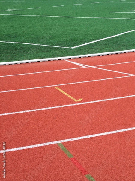 Fototapeta Terrain de foot et piste d'athlétisme