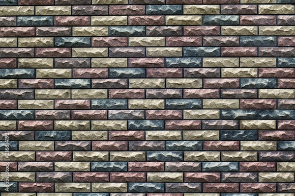 Fototapeta fragment of the wall with masonry of decorative bricks in different color schemes