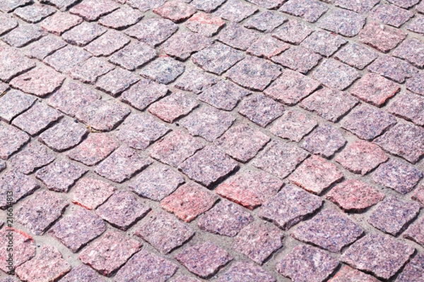 Fototapeta fragment of granite pavers at an angle in different color schemes