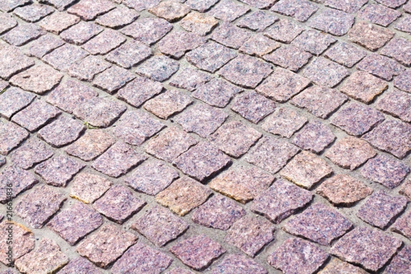 Fototapeta fragment of granite pavers at an angle in different color schemes