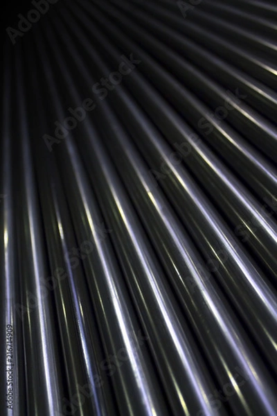 Obraz Pattern of lots of shiny stainless industrial metal steel pipe tubes to cut weld process and work with