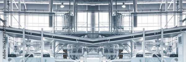 Fototapeta Blurred and toned as if Industrial background - pipes, feed line, supports, equipment, machinery. Industry concept. Wide panoramic image. Copy space.