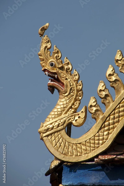 Fototapeta Battambang Cambodia, golden dragon roof carving at Wat Kandal 