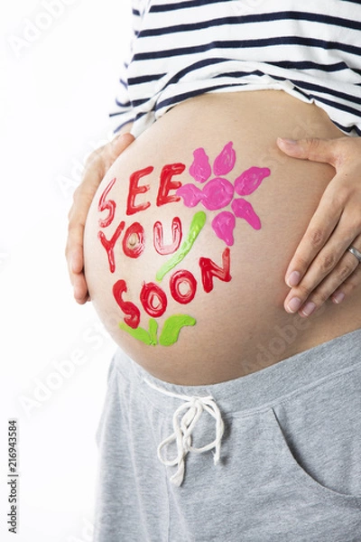 Fototapeta 妊娠している女性のお腹に描いたメッセージ