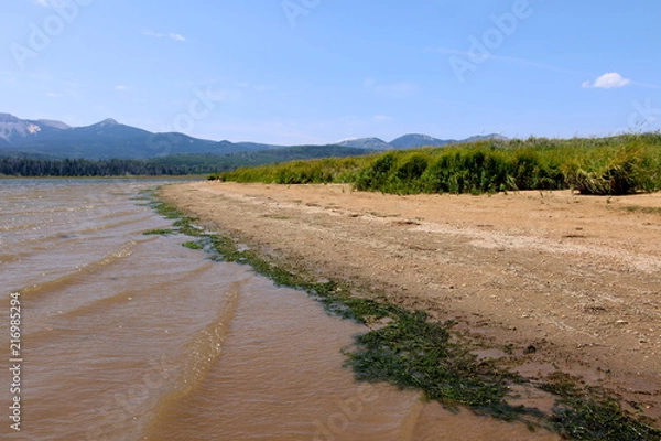 Obraz Deserted mountain lake beach