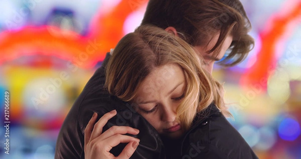 Fototapeta Close up of Caucasian man hugging his beautiful girlfriend