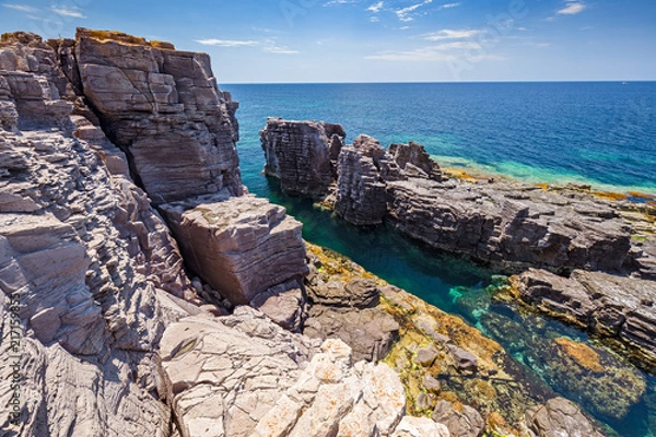 Fototapeta Rock formations on the cliffs of the island of San Pietro in Sardinia, Italy.
