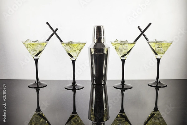 Obraz Four cocktails and cocktail shaker aligned