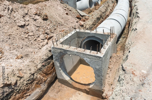 Fototapeta Concrete drainage pipre row on the conctruction work.