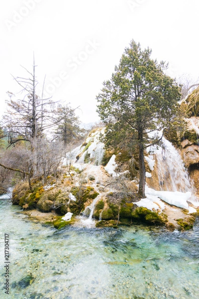 Obraz Waterfall from a cliff in the forest