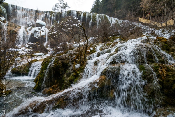 Obraz Waterfall from a cliff in the forest