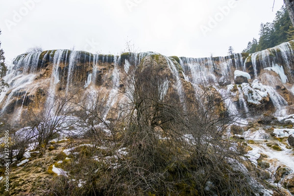 Obraz Waterfall from a cliff in the forest