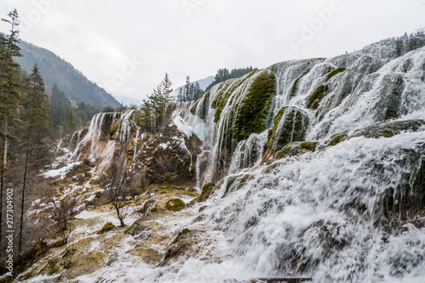 Obraz Waterfall from a cliff in the forest