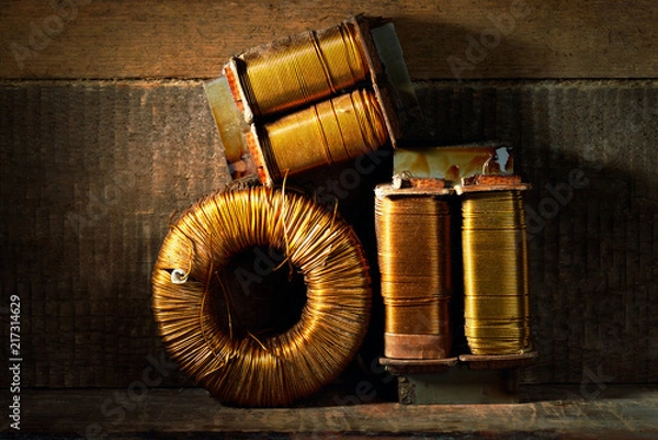 Obraz Three old copper wire coils.