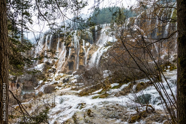 Obraz Waterfall from a cliff in the forest