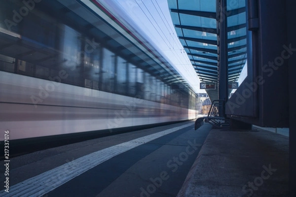 Obraz Moving tram train driving through a train station moving public transport