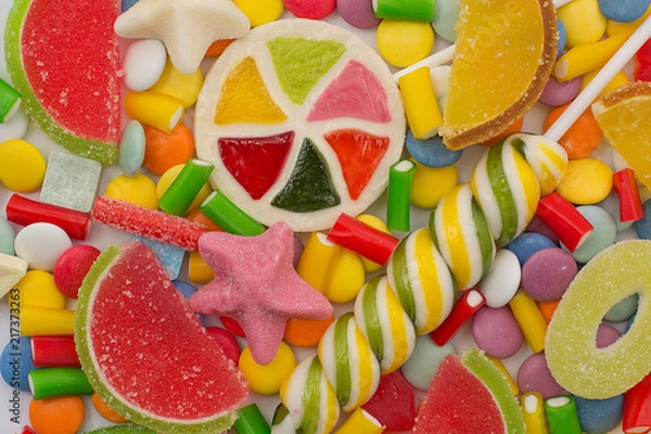 Obraz Multicolored candy and lollipops. background