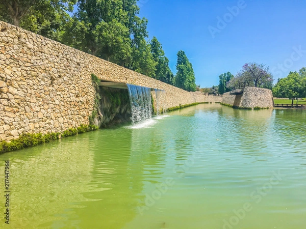 Obraz waterfall in a lake landscape view