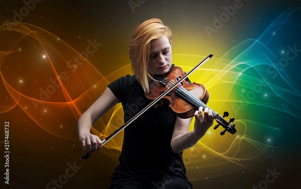 Fototapeta Serious classical violinist with fabled sparkling wallpaper