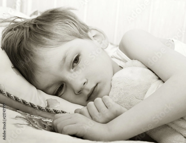Obraz Sad child in bed