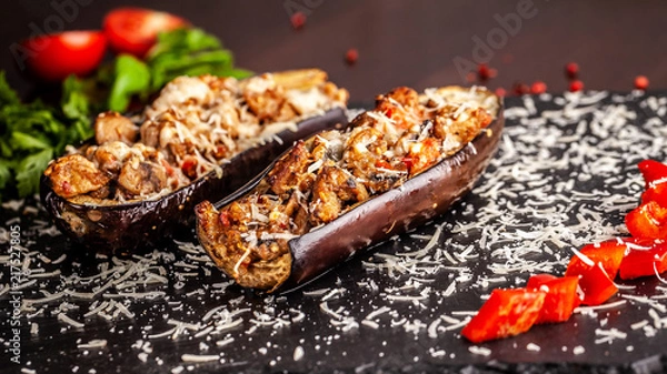 Fototapeta Portuguese cuisine. Baked eggplants with mushrooms, meat, vegetables and parmesan cheese. Copy space, selective focus