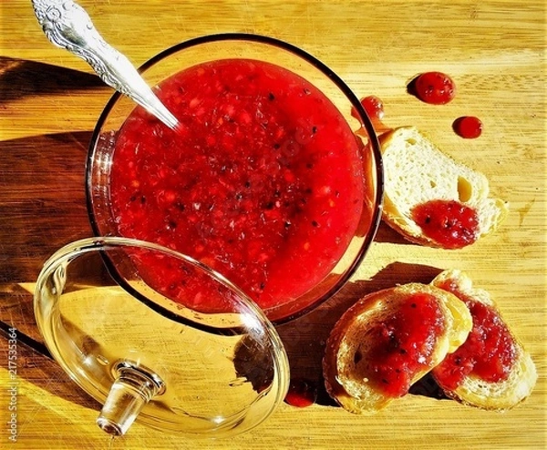 Obraz A Red jam with a transparent bowl with tosts on the wooden background