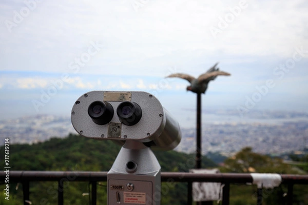 Fototapeta Coin operated viewing scope with fake pole mounted bird on top of Mt. Rokko in Hyogo, Japan