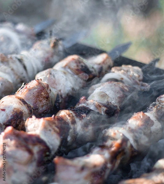 Fototapeta meat on skewers roasted on coals