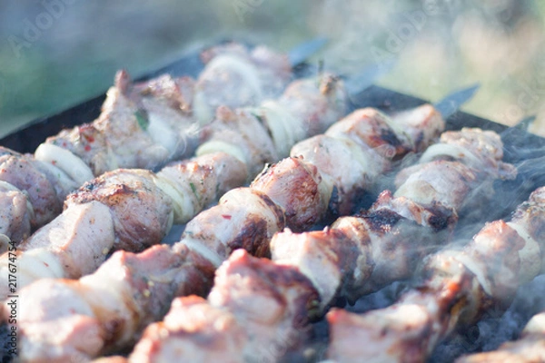 Fototapeta meat on skewers roasted on coals