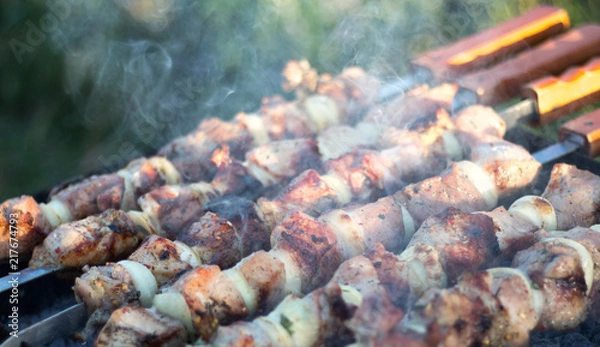 Fototapeta meat on skewers roasted on coals
