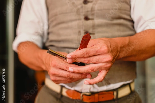 Fototapeta Blades and razor tools of a barber.
