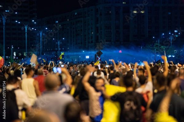 Obraz Romania, Bucharest - August 10, 2018: Police using water canons to split the crowd protesting anti PSD government