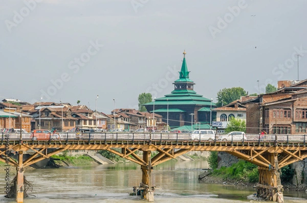 Fototapeta Srinagar, Jammu and Kashmir, India - July 4, 2017 : Old town Srinagar, ancient wooden and stone houses at Srinagar old city, Srinagar, Kashmir, India.