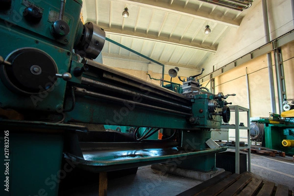 Fototapeta An empty lathe at the enterprise in the workshop is a wide-angle plan.