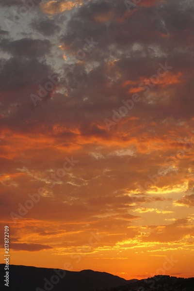 Fototapeta Orange cloudy sky during a sunset