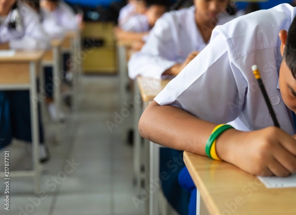 Obraz Students sit the exams in the classroom.