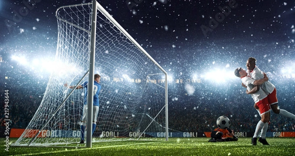 Obraz Intense soccer moment in front of the goal on the professional soccer stadium.