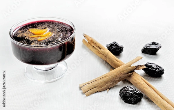 Obraz Popular Peruvian desserts called Mazamorra Morada made out of purple corn with cinnamon sticks.
