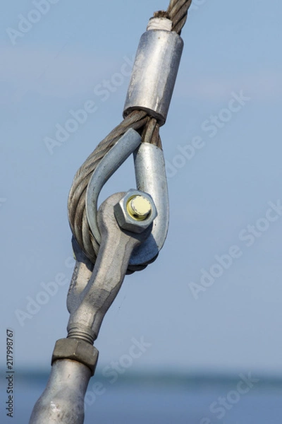 Fototapeta Loop connections of steel rope. Metal fastening element in ferry.