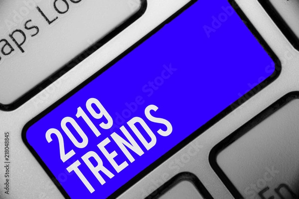 Obraz Writing note showing 2019 Trends. Business photo showcasing things that is famous for short period of time in current year Keyboard blue key Intention computer computing reflection document.