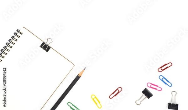 Obraz top view book, pencil for note isolated on white background with colorful paper clip, black paper clip decorate by chrysanthemum, yellow and purple flower, green leave. Desk office concept, copy space
