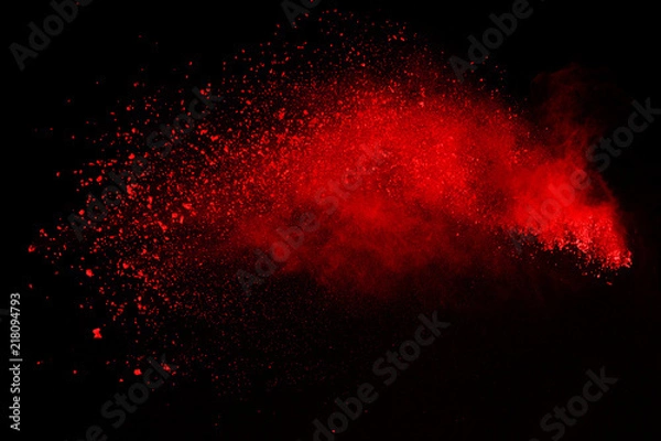 Fototapeta Abstract of red powder explosion on black background. Red powder splatted isolate. Colored cloud. Colored dust explode. Paint Holi.