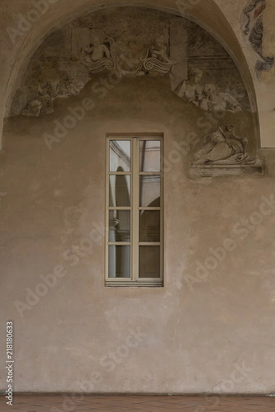 Fototapeta Archway, Columns and Courtyard: reflected in the Glass of a Window
