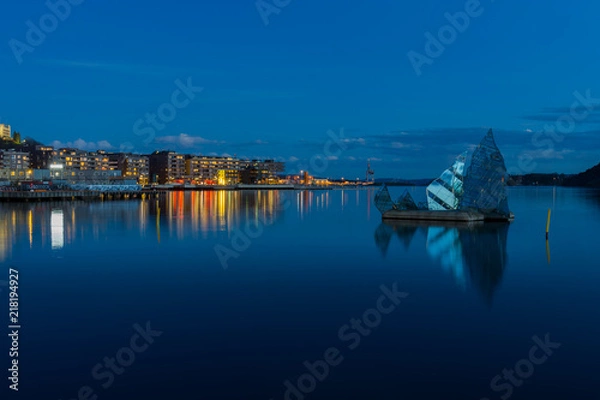 Obraz Exterior night view of the city and the glass structure art in the middle of the bay, located in Oslo