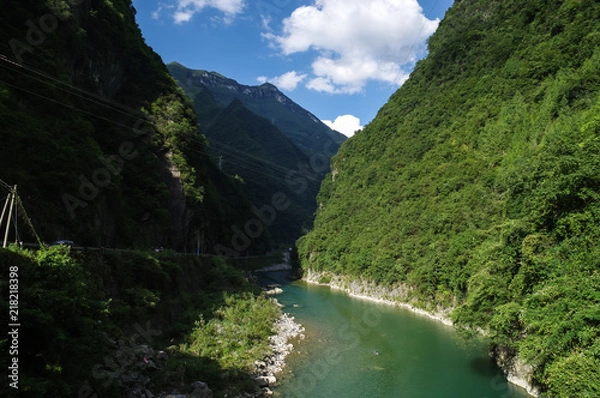 Fototapeta Limpid Stream Between Two Mountains