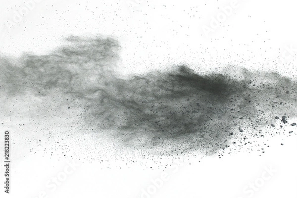 Fototapeta Black powder explosion. Closeup of black dust particles explode isolated on white background.