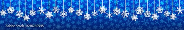 Fototapeta Christmas seamless banner with white hanging snowflakes with shadows on blue background