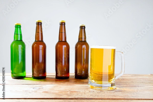 Fototapeta glass of beer on wooden table, top view. Beer bottles. Selective focus. Mock up. Copy space.Template. Blank.
