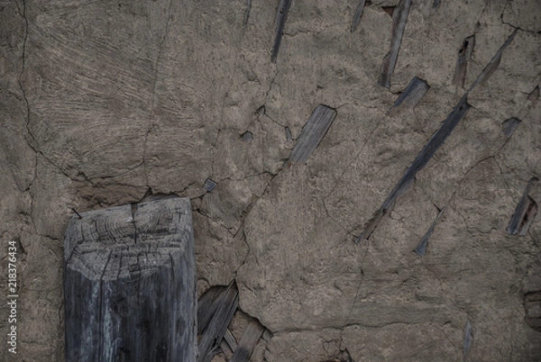 Obraz clay wall with logs. texture