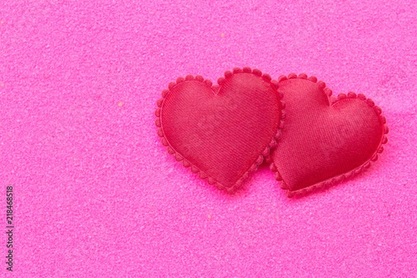 Fototapeta Red heart on pink sand